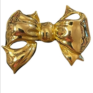 Gold finish shiny FUN bow brooch