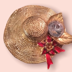 Gold tone hat crystal brooch