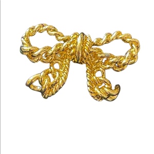 Vintage gold Nina Ricci bow brooch