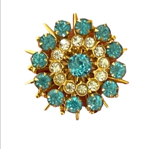 - Vintage blue clear crystal gold starburst brooch