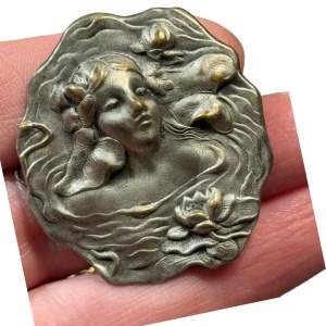 Lovely vintage metal girl with flowers high relief mold brooch